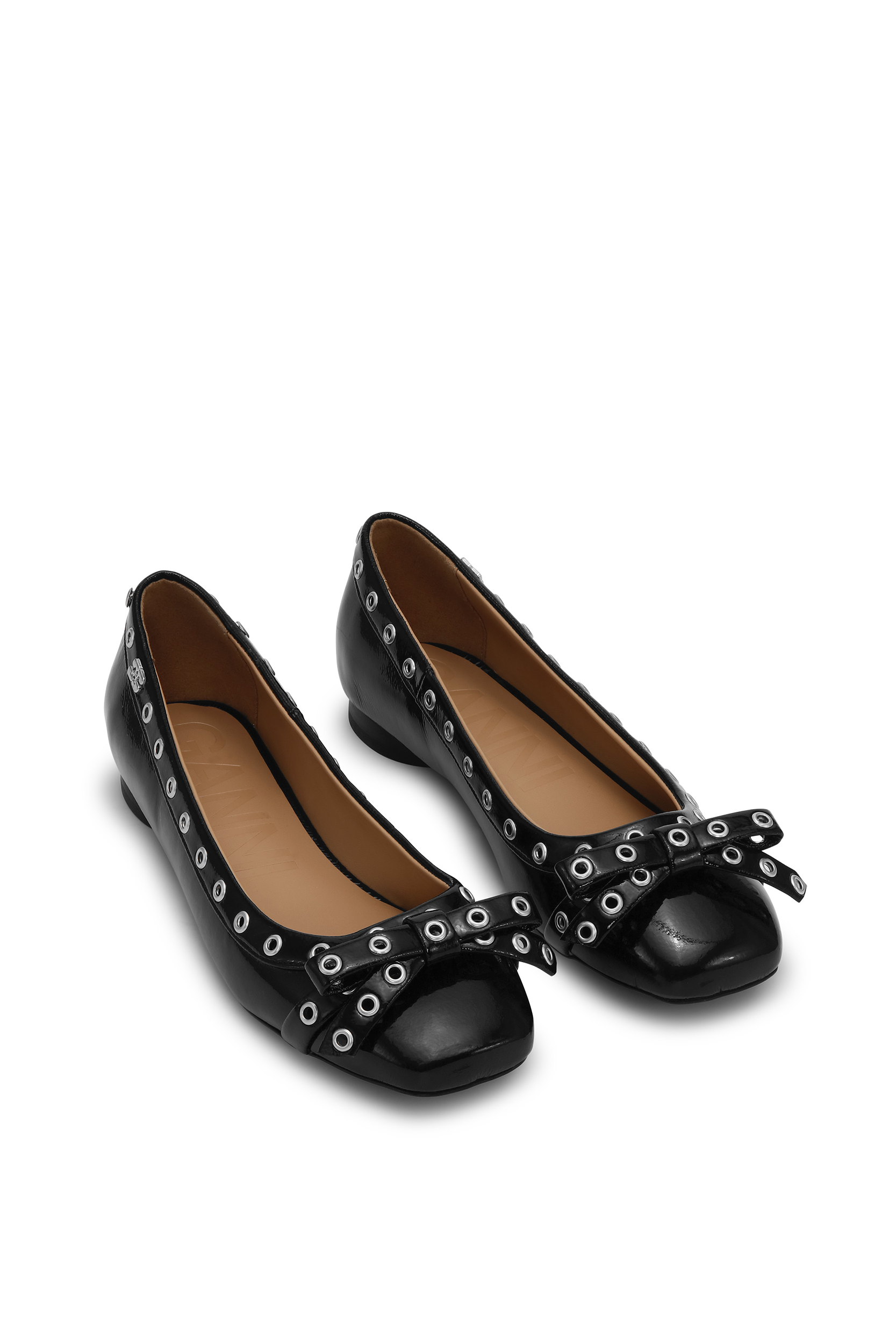 Top view of the Ganni Eyelets Bow Ballerina Naplack. Flats from Ganni in the color black, featuring a bow for added style. 
