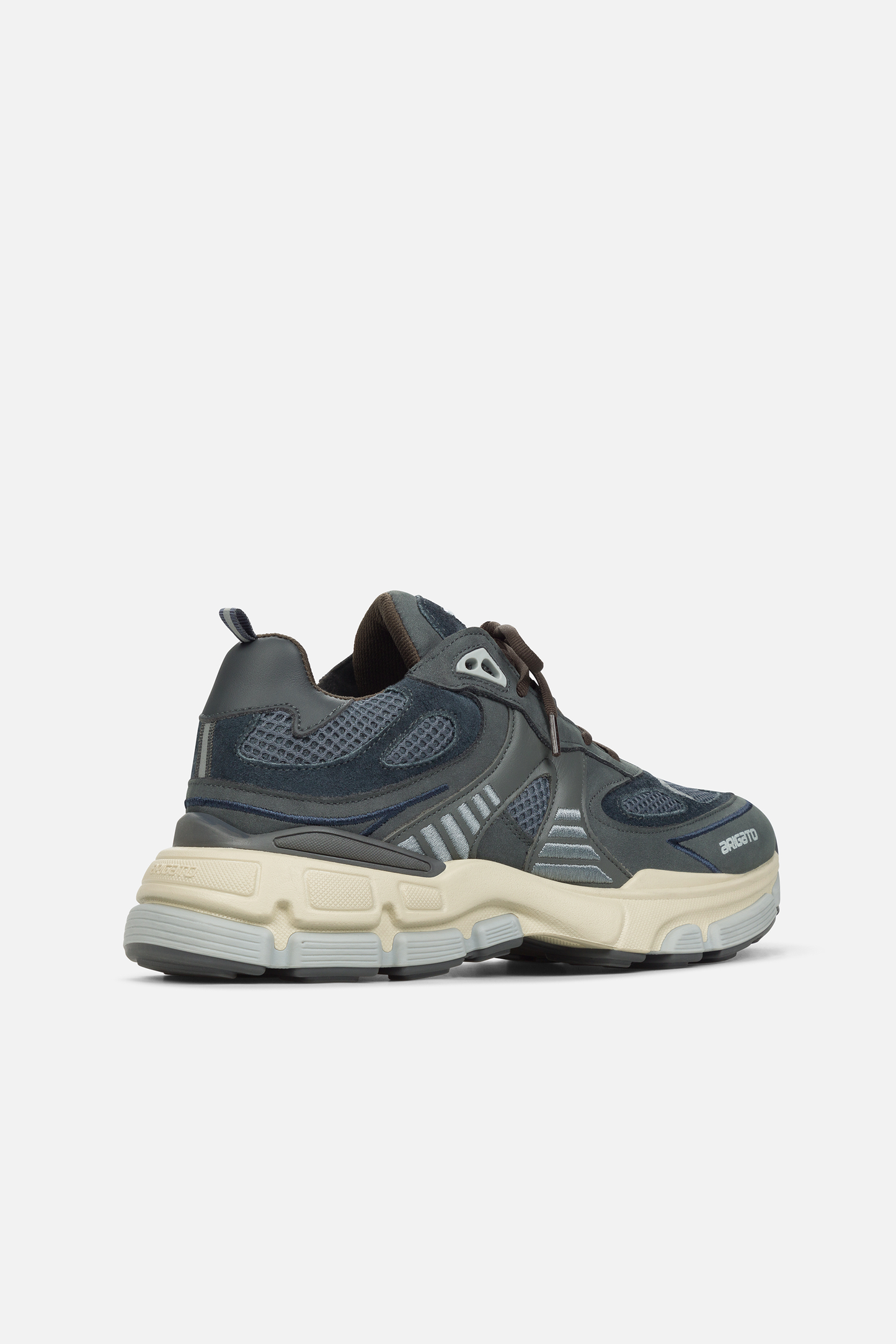  Back view of a black and grey Axel Arigato Sphere Runner sneaker with mesh and leather panels, featuring a chunky off-white sole.