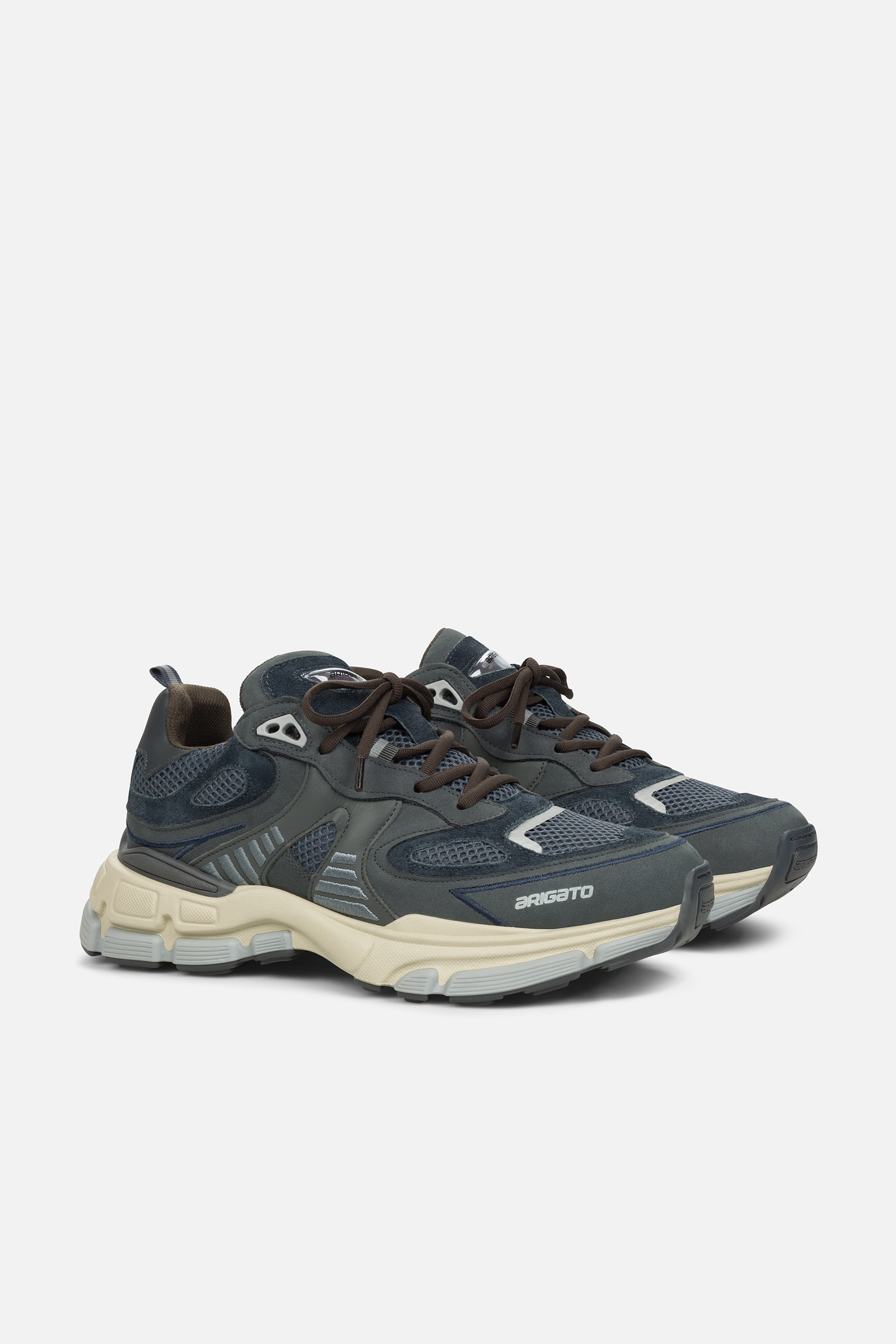 Side view of a black and grey Axel Arigato Sphere Runner sneaker with mesh and leather panels, featuring a chunky off-white sole.